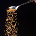 Sarvaay powdered jaggery close up on spoon for tea and coffee